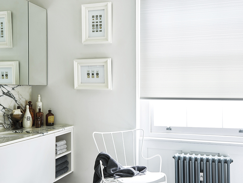 White roller blind in a white modern bathroom