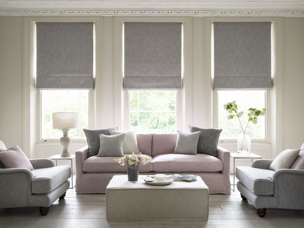 Grey and pink living room with Roman blinds