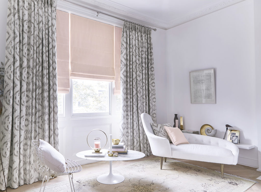 Feminine living room with Roman blinds and curtains