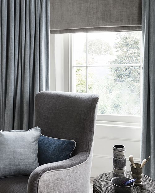 Grey and blue decor in reading corner