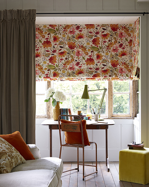 Colourful orange decor reading corner office.