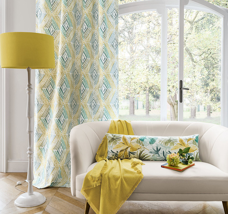 Colourful living room with bright yellow floor lamp