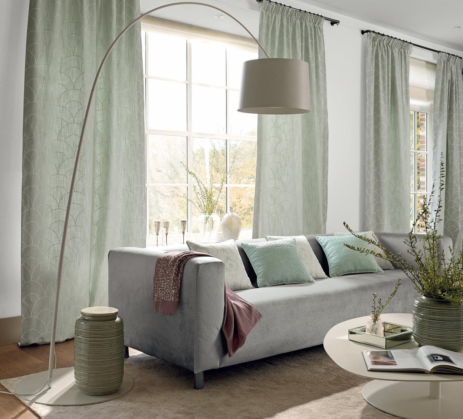 Curving floor lamp with grey lamp shade
