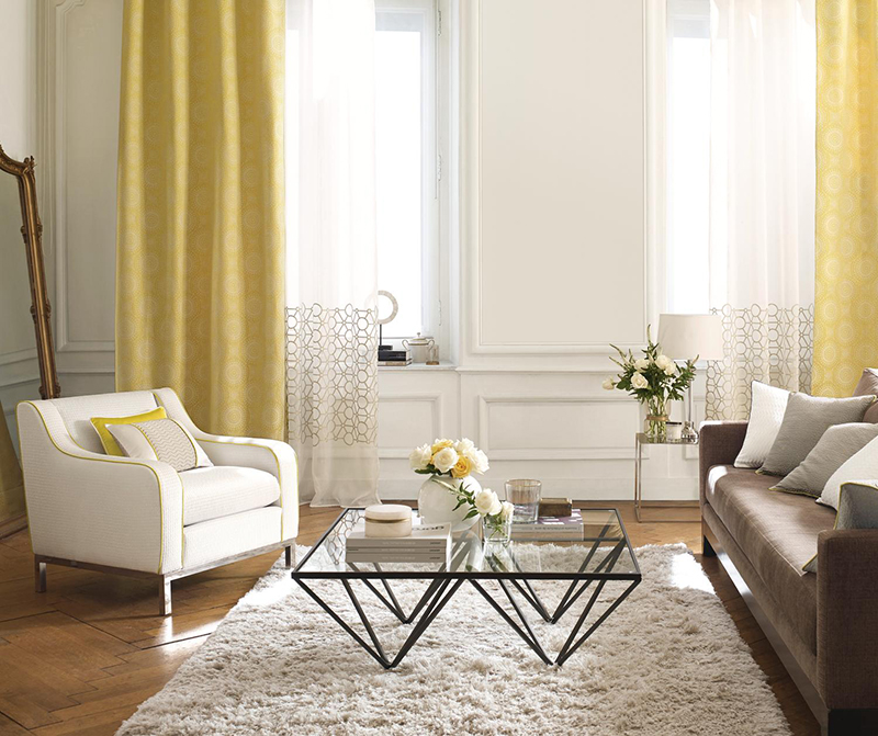 Neutral modern interiors with lemon yellow curtains