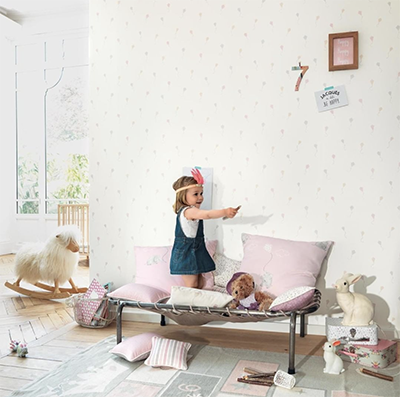 Child playing in a safe bedroom