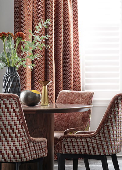 Dark red curtains for a traditional dining room.