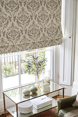 Elegant Roman blind for a traditionally designed living room.