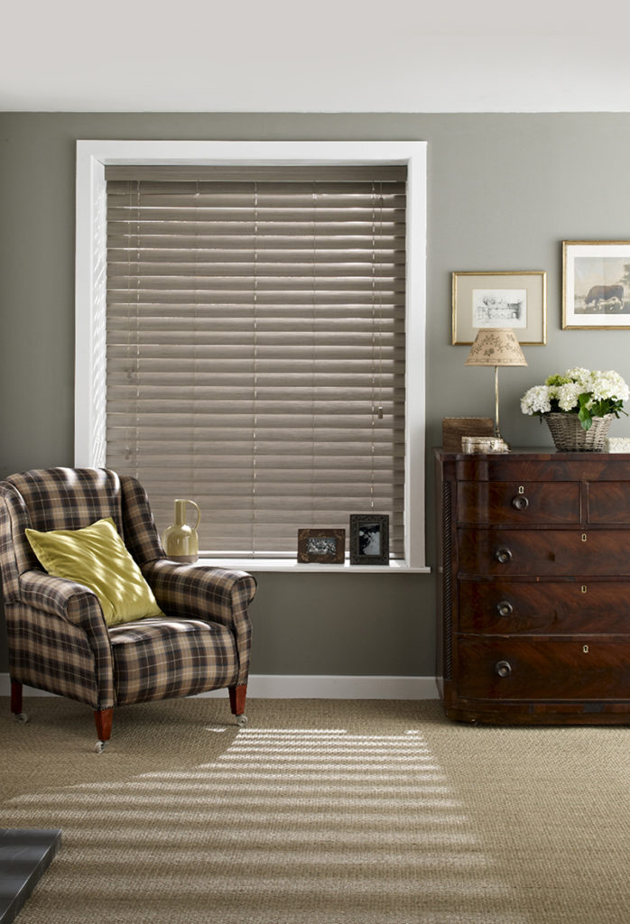 A light wooden blind for a traditional bedroom.